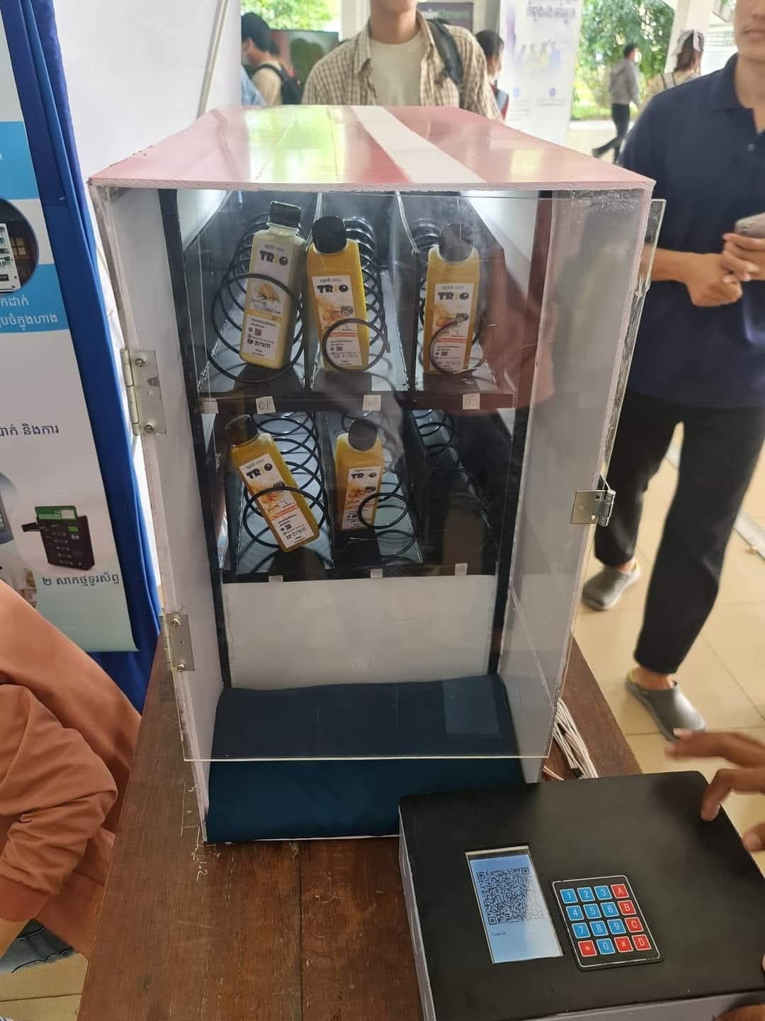 Earlier vending prototype with a QR display at an event